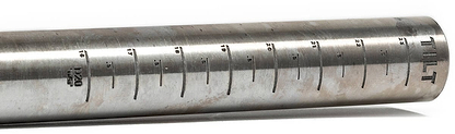 Close-up of Tilt's cold-formed aluminum SCS stunt scooter bars in chrome, featuring engraved measurement markings and numbers, used for determining ring sizes.