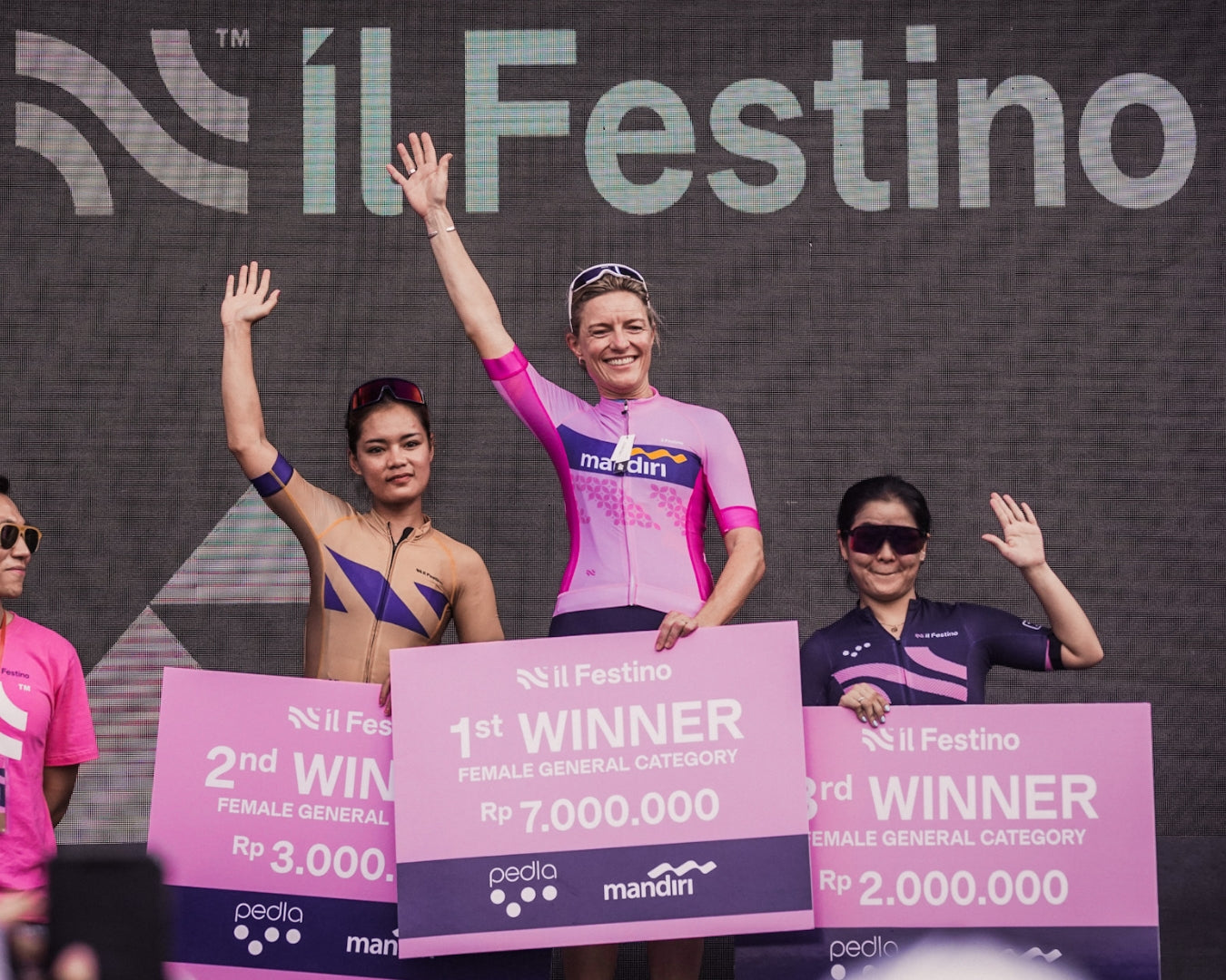 Jenny Pettenon of the Pana Organic Pedla team on the podium, winning 1st place in the Women's GC.