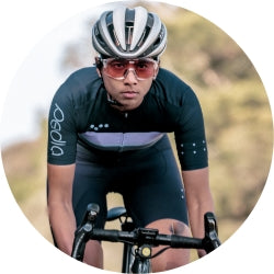 Girl cycling in Pedla gear in race on road