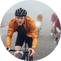 Group of riders wearing Pedla cycling kit in rain