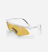 Sunglasses with gold lenses and white frame on a light gray background