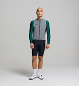 Side profile of cyclist in reflective gilet; breathable mesh panels visible for airflow and comfort.