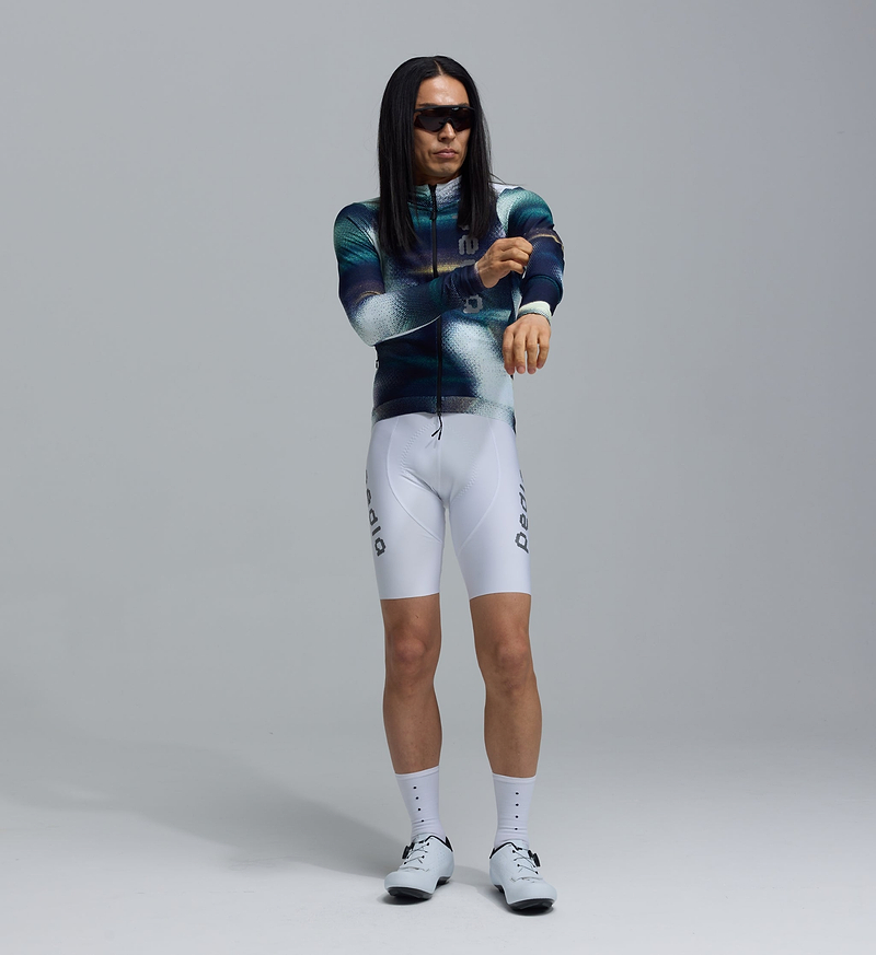 Pedla Colour Wheel Men's Thermal Long Sleeve Jersey Motion Blue - The Thermal Long Sleeve Jersey is made for deep winter rides. Now updated with Chillblock fabric, it offers reliable warmth with a thermal fleeced interior—ideal for cold mornings, long training blocks, and frosty commutes. The soft performance knit traps heat without sacrificing breathability.