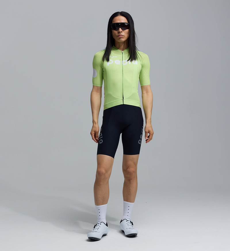 Men's Dots Air Jersey Glow front view, lightweight breathable cycling jersey with mesh panels on chest, back and sleeves, moisture-wicking fabric, UPF 15+ sun protection, slim performance fit and low-profile 3-pocket rear