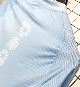 Men's Air long-sleeve cycling jersey back view — blue gradient with dots, breathable mesh panels on chest/back/sleeves, ventilated textured back pocket, lightweight moisture-wicking fabric, UPF 15+ sun protection, close unrestrictive fit.