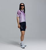 Men's LunaLUXE Classic mauve-fade dot print cycling jersey, side view — performance road jersey with SPF50 breathable moisture-wicking fabric, four-way stretch, ventilation panels, extended sleeves and silicone hem gripper