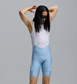 Pedla SuperFIT 2.0 men's powder blue cycling bib shorts close-up, Italian breathable fabric, mesh white bib, Elastic Interface chamois, seamless non-stitched cuff, reflective logos, aerodynamic muscle-support fit for performance cycling