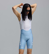 Pedla SuperFIT 2.0 men's powder blue cycling bib shorts close-up, Italian breathable fabric, mesh white bib, Elastic Interface chamois, seamless non-stitched cuff, reflective logos, aerodynamic muscle-support fit for performance cycling