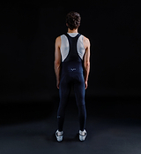 Men's SuperFLEECE 2.0 black thermal cycling bib tights (back view) with lightweight brace system, Italian Roubaix fleece-back fabric, perforated center back, reflective logos and Elastic Interface Carbonium chamois for winter rides