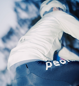Men's porcelain thermal cycling jacket back view, windproof water-resistant performance knit, concealed rear zip pocket, reflective strips, hem gripper and two-way waterproof zipper for winter riding and commuting