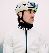 Close-up of men's porcelain thermal cycling jacket on cyclist with helmet and sunglasses — windproof, water-resistant thermal knit, SAB two-way waterproof zipper, reflective details, hem gripper, concealed rear pocket for winter commuting.