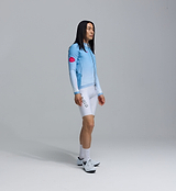 Men's blue gradient thermal long-sleeve cycling jersey side view, Chillblock fabric with thermal fleeced lining, moisture-wicking, breathable, UPF 50+, reflective sleeve logos, articulated sleeves, two-way zipper, hem gripper and zip side pocket