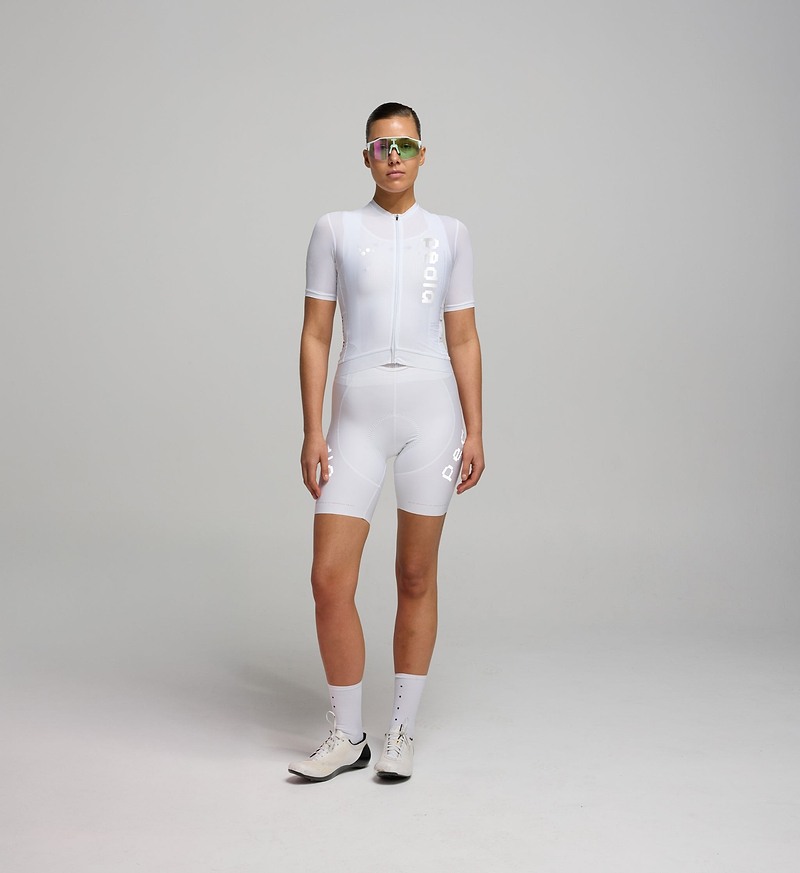 Dots Women's SuperFIT 2.0 Bib Short Reflective White - **The White SuperFIT bib shorts fit slightly larger than our standard SuperFIT sizing. If you are between sizes, we recommend sizing down.** Experience unparalleled comfort with SuperFIT 2.0 Cycling Bib Shorts, Pedla's most cherished bib shorts now upgraded, elevated by an advanced brace system for superior support and ventilation.