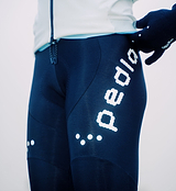 Close-up of black Women's SuperFLEECE 2.0 thermal cycling bib tights with lightweight brace system, Italian Roubaix fleece-back fabric, Elastic Interface Carbonium chamois, perforated rear breathability panel and reflective logos