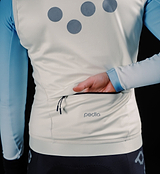 Women's thermal cycling gilet in porcelain, close-up of windproof waterproof performance knit, soft matte finish, SAB two-way zip, hem gripper, concealed rear zip pocket and reflective chest/back/shoulder details for winter cycling