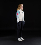 Womens porcelain thermal cycling gilet side view, windproof waterproof thermal knit vest with soft matte finish, SAB two-way waterproof zip, reflective details, hem gripper and concealed rear pocket, lightweight winter layer