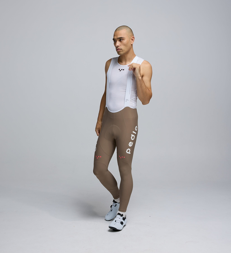 Front view of Pedla’s Men’s SuperFIT 2.0 Bib Tight in Stone showcasing sleek fit and high-performance design