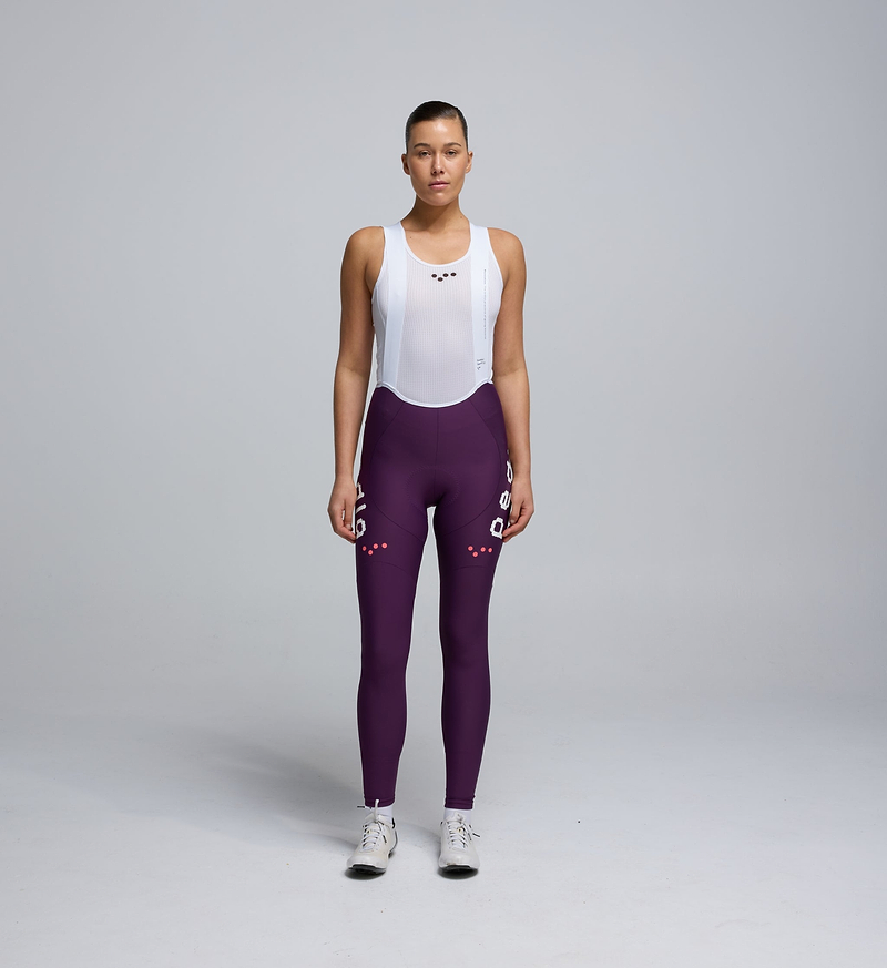 Front view of Pedla’s Women’s SuperFit 2.0 Bib Tight in Aubergine highlighting sleek design and premium construction