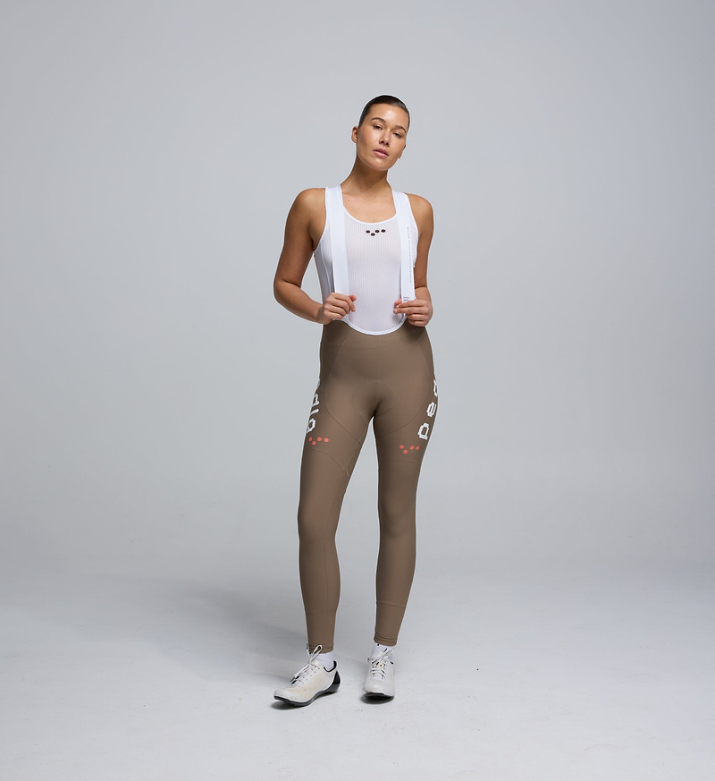 Front view of Pedla’s Women’s SuperFit 2.0 Bib Tight in Stone highlighting sleek design and high-quality construction