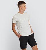 Pedla Logo Tee in white, made from 100% cotton, shown in side front view on model.