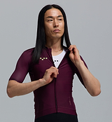 Close-up of men's Essentials BOLD Classic cycling jersey in fig — LunaLUXE performance, breathable SPF50 fabric, moisture-wicking four-way stretch, ventilation panels, extended sleeves and silicone gripper hem, form-fitting