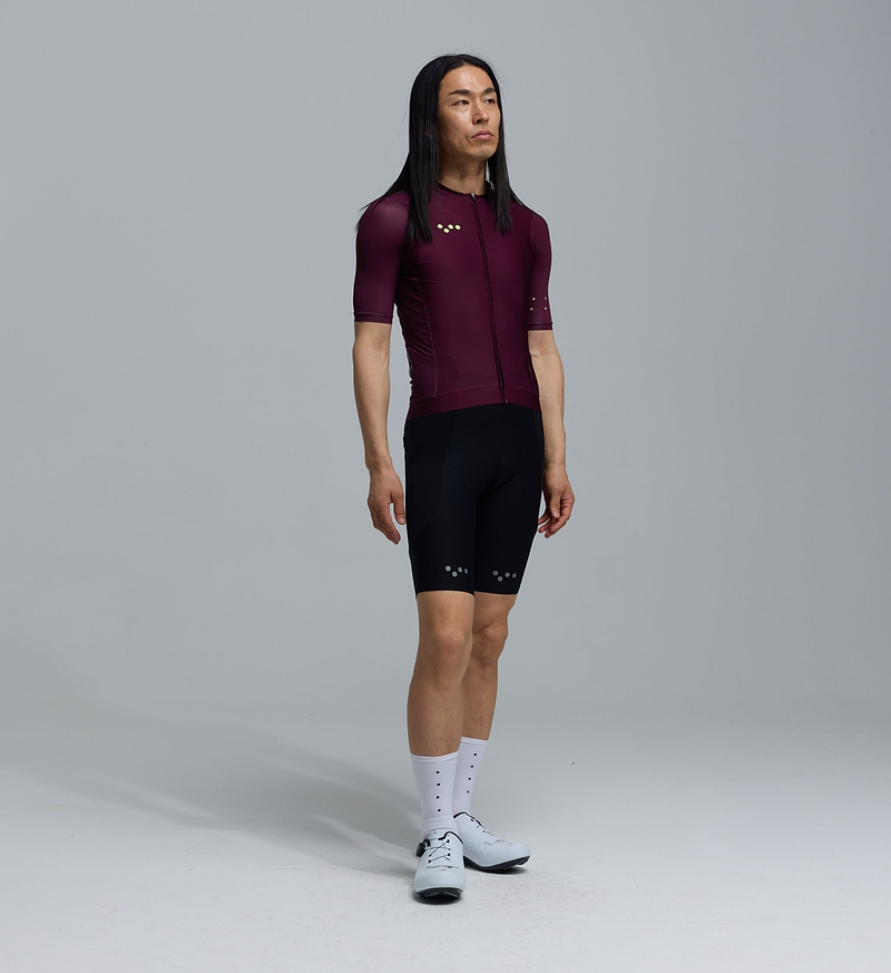 Men's LunaLUXE Classic cycling jersey (fig) front view — performance short-sleeve, SPF50, breathable moisture-wicking four-way stretch, ventilation panels, extended sleeves, low-cut collar, silicone gripper hem