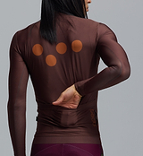 Men's long sleeve cycling jersey, wood-brown with orange dot graphic — form-fitting breathable SPF50 fabric, moisture-wicking four-way stretch, side ventilation panels, silicone gripper hem, rear pockets