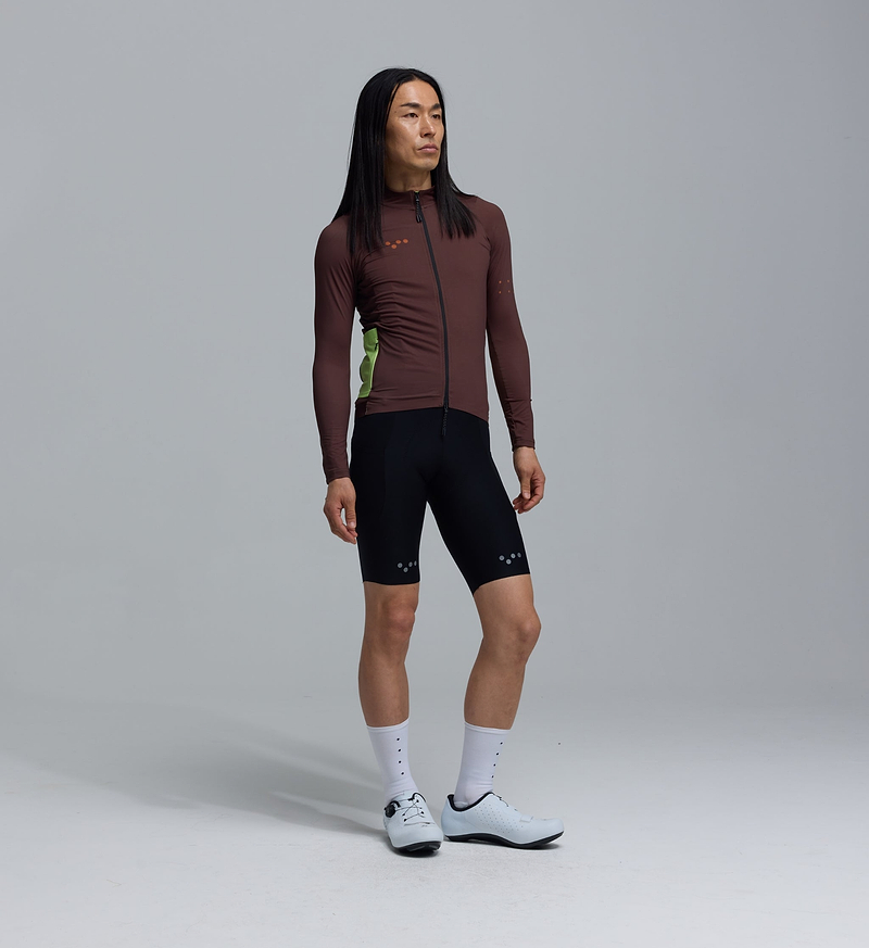 Men's midweight long-sleeve cycling jersey, wood brown with green side panels, thermal brushed interior, moisture-wicking breathable fabric, articulated sleeves, hem gripper, SAB two-way zipper, 4 rear pockets for cool-weather rides