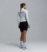 Women's Essentials BOLD Classic cycling jacket, back view, porcelain — lightweight windproof water-resistant long-sleeve shell with breathable mesh back and underarms, rear zip pocket/packable, two-way zipper, silicone hem, athletic fit