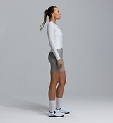 Women's Essentials Long Sleeve Classic cycling jersey (porcelain) side view — form-fitting performance road bike top with SPF50 breathable moisture-wicking fabric, four-way stretch, side ventilation panels and silicone gripper hem