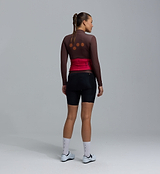 Women's midweight long-sleeve cycling jersey back view, wood-brown with red waist panel, breathable brushed-thermal interior, moisture-wicking, hem gripper, four rear pockets, articulated sleeves for cool-weather layering