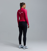 Women's thermal long-sleeve cycling jersey back view in fuchsia, Chillblock fleece-lined, breathable, moisture-wicking, UPF50+, reflective logos, articulated sleeves, hem gripper, three rear pockets including zip pocket