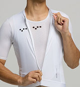 Close Up view of male cyclist in Core White Classic Jersey – form-fitting silhouette with extended sleeves and low collar designed for aerodynamic road performance.