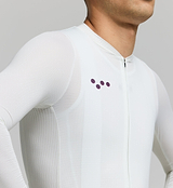 Close-up of mesh sleeve and technical fabric – lightweight, UPF 15+ sun-protective material with breathable texture and refined seam detailing for warm-weather cycling comfort.