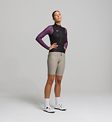 Side angle of black women’s cycling vest – tailored silhouette with mesh back panel and elasticated armholes, allowing ease of movement and airflow during rides in any season.
