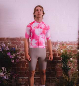 Model wearing Floral Men's Classic Jersey - Cosmos front view, highlighting form-fitting cut, low collar, and high-performance breathable fabric