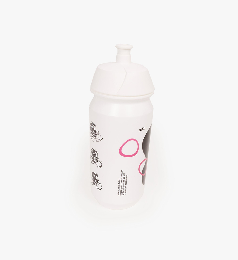 Pedla Tacx Shiva 500ml biodegradable white cycling water bottle (bidon) with pink & black graphics — BPA- & PET-free, lockable pull lid, ergonomic squeeze design, wide opening; eco-friendly reusable bottle for road, gravel and indoor cycling