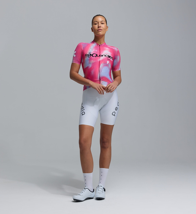 Women’s Frequencies Classic Cycling Jersey (Fusca pink) front on model — SPF50 breathable, moisture-wicking, four-way stretch fabric with extended sleeves, low-cut collar and silicone hem gripper for performance road cycling, training and long rides.