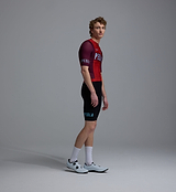 Pedla Heritage Men's Classic LunaLUXE Performance Cycling Jersey side view in fox red — breathable SPF50 moisture-wicking four-way stretch with side ventilation panels extended sleeves low-cut collar and silicone hem gripper