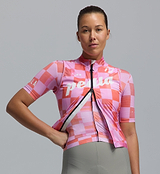 Heritage Women's LITE pastel pink checkered cycling gilet — lightweight, packable, windproof and water-resistant vest with breathable mesh back, SAB two-way zipper, 2.5cm silicone hem, reflective details and three reinforced rear pockets for road cycling, training, racing and commuting