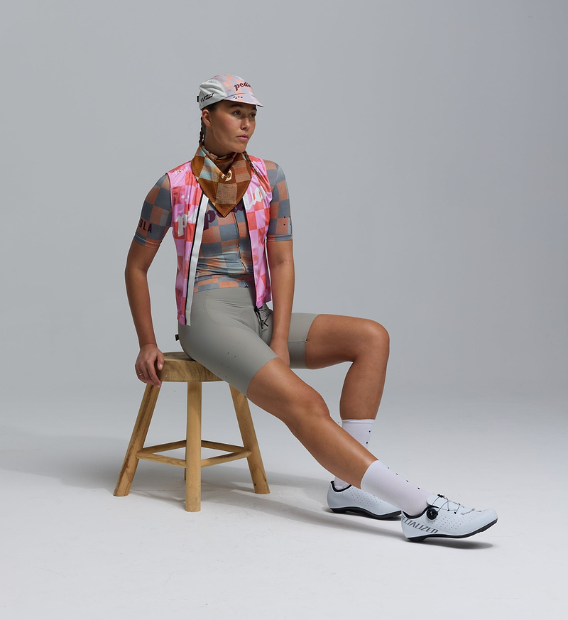 Heritage Women's LITE cycling gilet in pastel checkers — lightweight, packable, windproof & water‑resistant front with breathable mesh back; recycled materials, silicone hem, SAB two‑way zipper, reflective details, three reinforced rear pockets for road cycling, training, racing and commuting