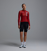 Heritage women's thermal long-sleeve cycling jersey in Fox Red, Chillblock fleece interior, moisture-wicking, UPF 50+, reflective logos, articulated sleeves, SAB two-way zipper, hem gripper and three-pocket system