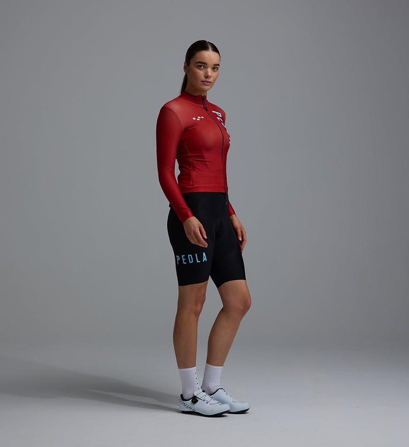 Heritage women's thermal long-sleeve cycling jersey in fox red, Chillblock fleece, moisture-wicking, UPF 50+, reflective logos, SAB two-way zipper, hem gripper, zip side pocket