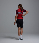 Women's Heritage Training Bib Short black, back view on model — PEDLA women's compressive cycling bib shorts with performance chamois, breathable brace system, seamless cuff and reflective logos for training and performance