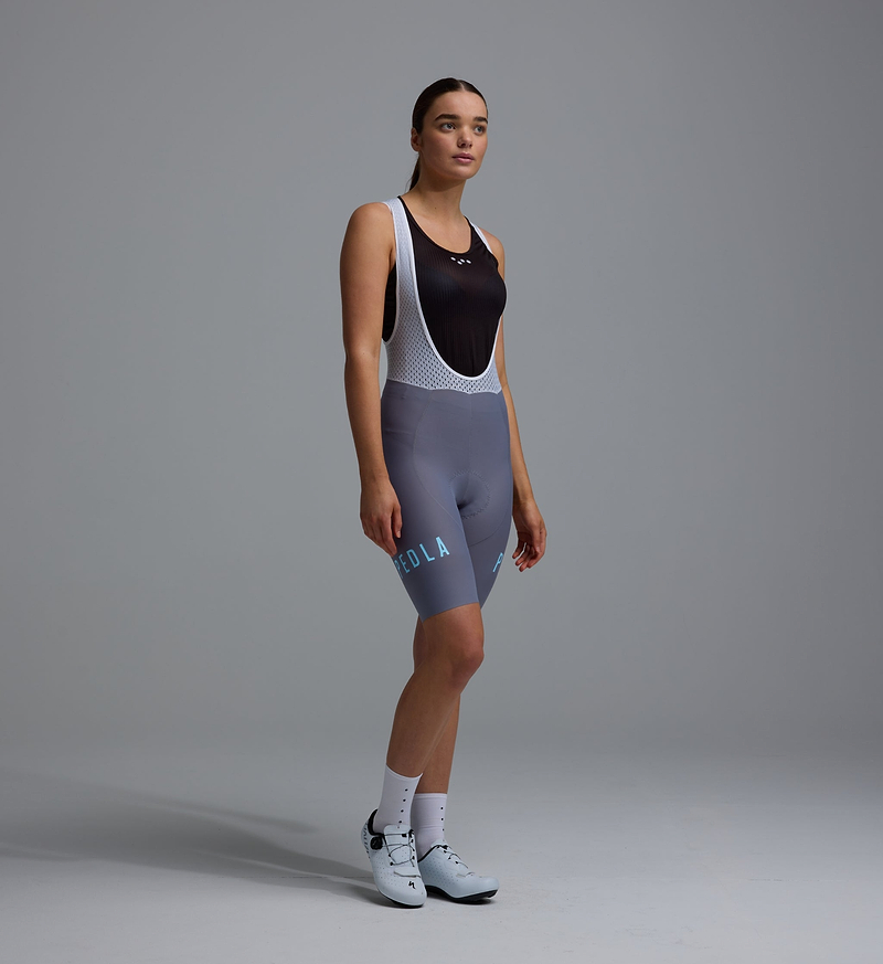 Heritage Women's Training Bib Short in Heritage Steel, front view — compressive women's cycling bib shorts with breathable mesh braces, seamless cuff, reflective logos and performance chamois for road and training