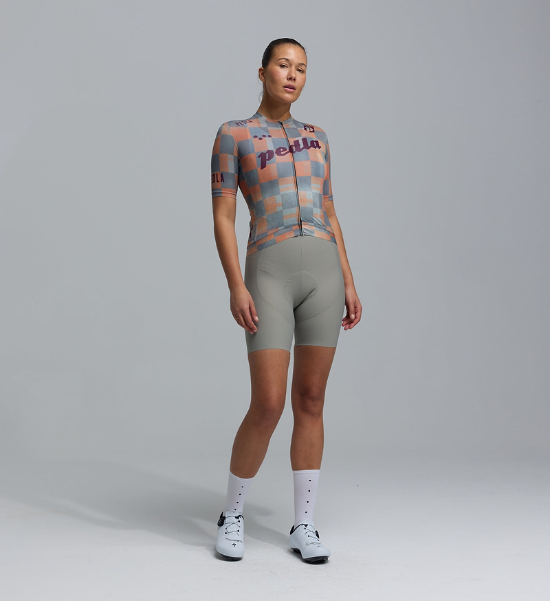 Pedla Heritage women's Training Jersey — Checkers Grey short-sleeve, all-season cycling jersey with UPF 30+; 83% REPREVE® recycled polyester/17% elastane; moisture-wicking microfiber, breathable perforated panels, four-way stretch, silicone gripper hem, extended sleeves and low-cut collar for road cycling, training rides and commutes.