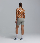Back view of Heritage Women's Training long-sleeve cycling jersey in Checkers Amber — all-season women's road/training jersey, UPF 30+, REPREVE recycled polyester, breathable perforated panels, moisture-wicking four-way stretch with silicone gripper hem