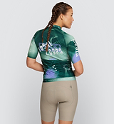 Back view of LOCAL LOOPS Women's Pro Pursuit 2.0 Cycling Jersey in Race Pine on model, featuring a streamlined pocket design, reflective accents for visibility, and high-quality Italian fabrics for superior performance on the road.