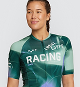 Close-up view of LOCAL LOOPS Women's Pro Pursuit 2.0 Cycling Jersey in Race Pine on model, detailing the heat-welded sleeve hems, breathable mesh panels, and lightweight fabric that ensure comfort, ventilation, and a race-ready fit during cycling.