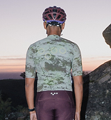 ON_OFF GRID SuperSYSTEM men's cycling jersey Erosion (back view) — ultralight high-stretch gravel & road performance jersey with ventilation, moisture-wicking fabric, bonded hem, ergonomic sleeves, hydration tube channel and reflective accents